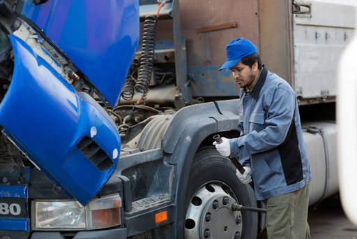 side-view-mechanic-checking-truck.jpg